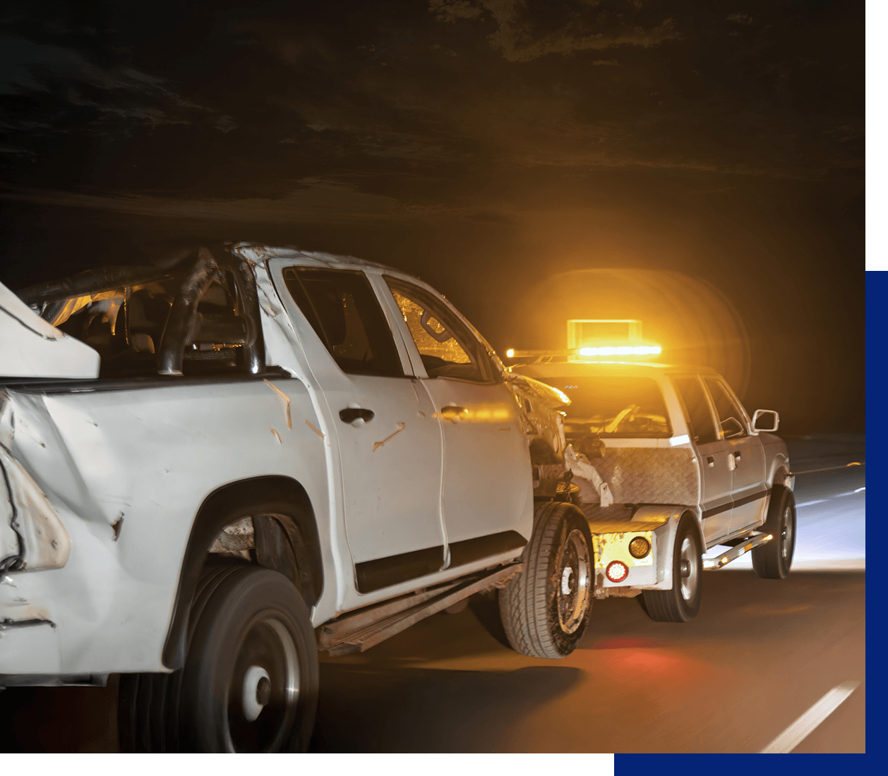Tow truck hauling wrecked vehicle