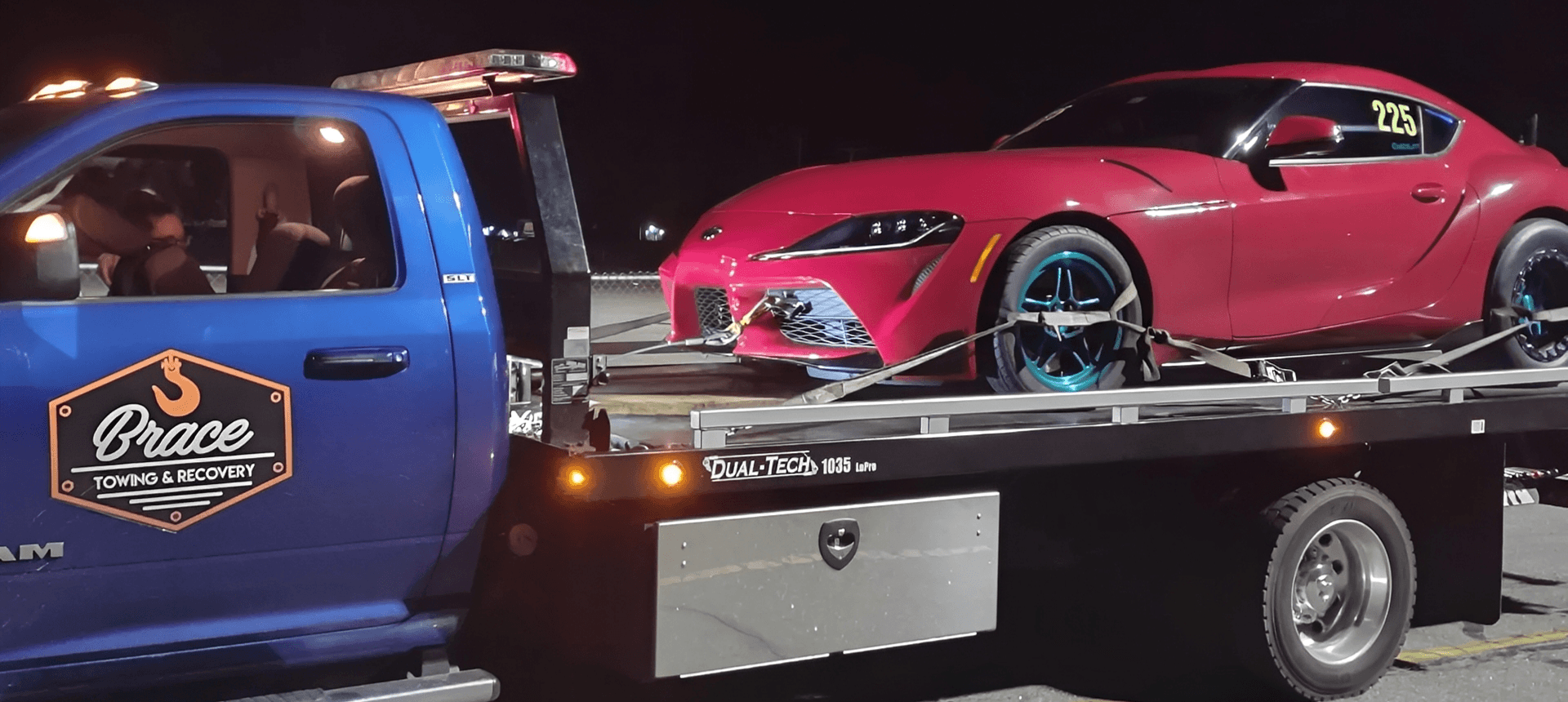 Nighttime towing of a red vehicle
