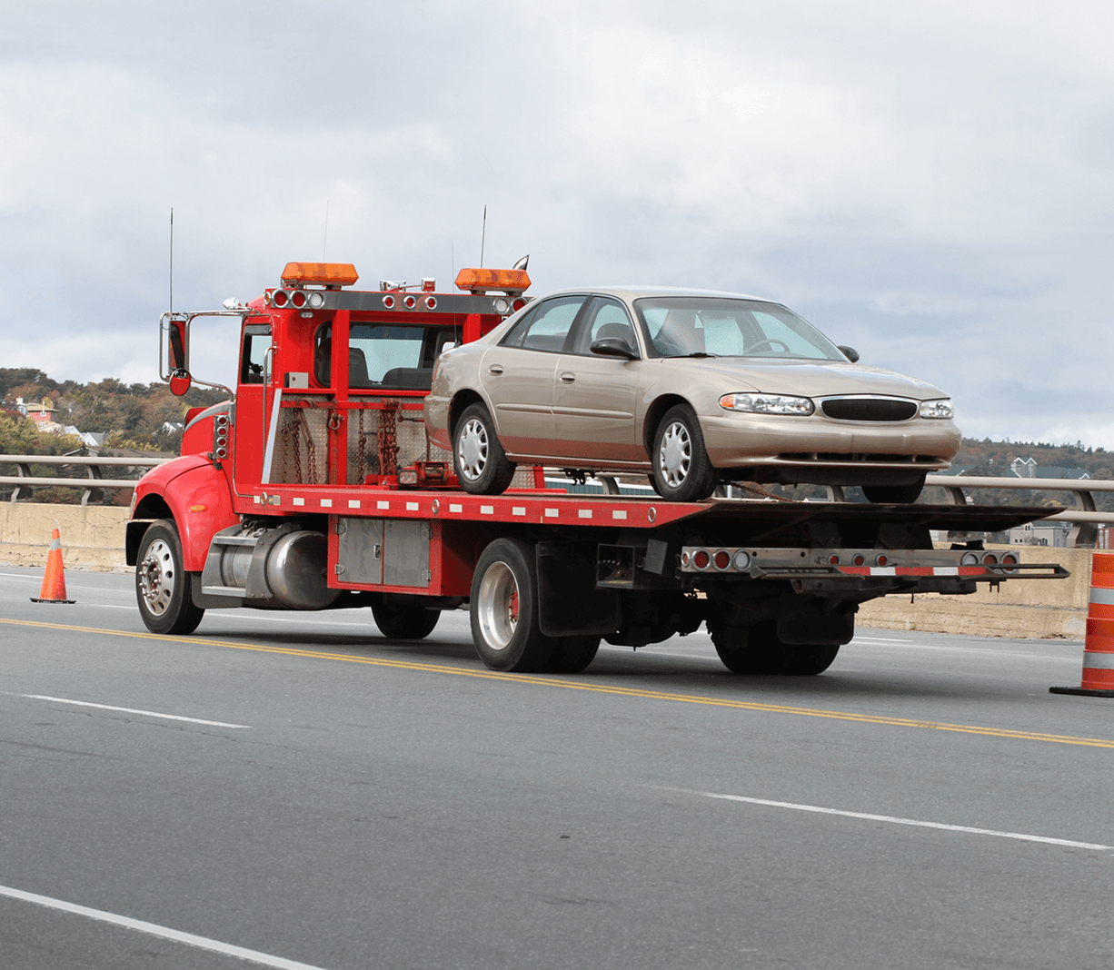Red tow truck on highway