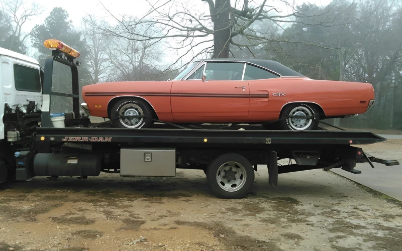 Vintage car being transported